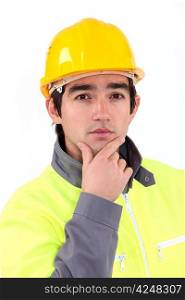 worker holding his chin