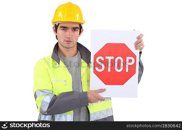 Worker holding stop sign