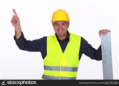 Worker in high-visibility vest pointing