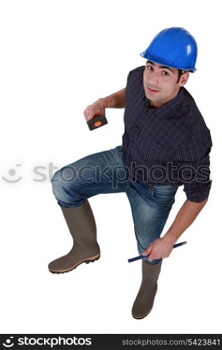 Worker in wellington boots