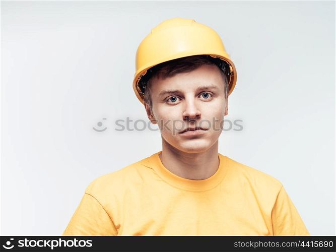Worker in yellow helmet