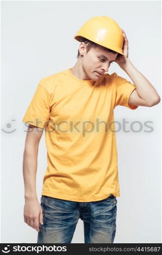 Worker in yellow helmet upset