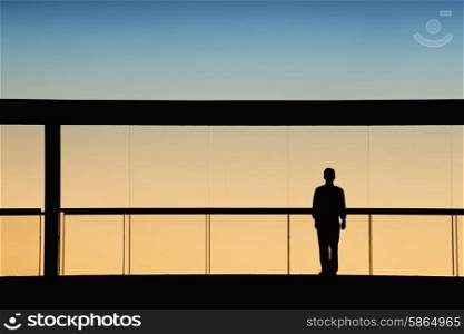 worker inside the modern building in silhouette