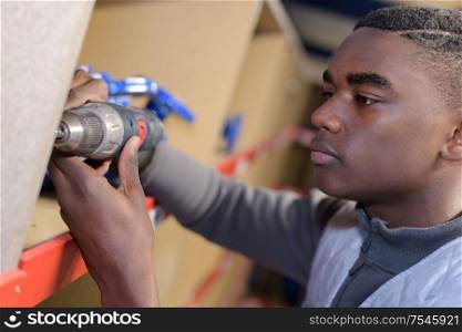 worker makes selfie with the drill
