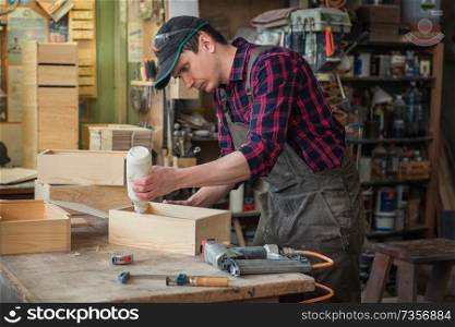 Worker making the wood box. Profession, carpentry and woodwork concept.. Worker making the wood box