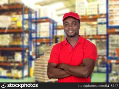 Worker man with red uniform in his workplace