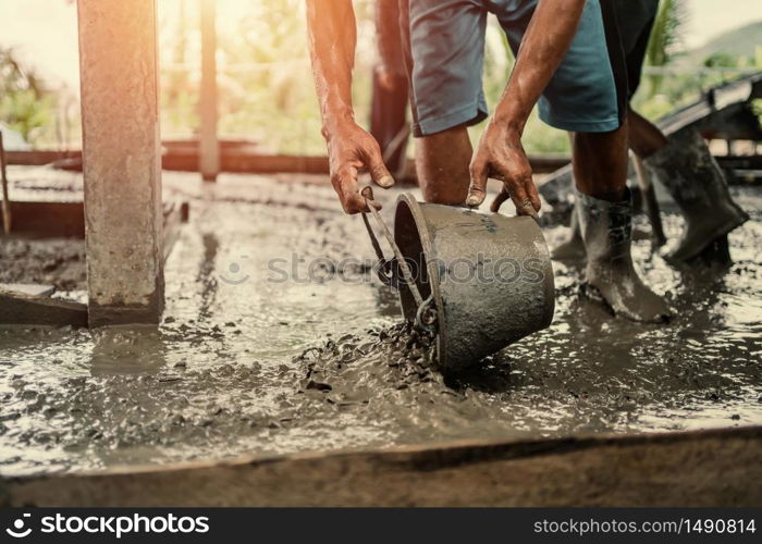 worker mix cement working in construction site