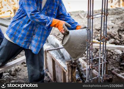 worker mixing cement mortar plaster for construction