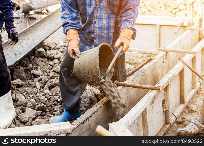 worker mixing cement mortar plaster for construction with vintage tone.