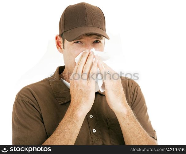 Worker on the job suffering with a cold. Isolated on white.