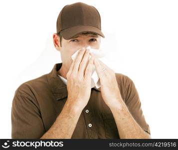 Worker on the job suffering with a cold. Isolated on white.