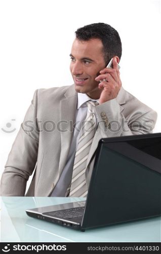 Worker on the phone in front of computer