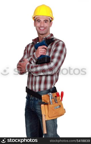 Worker posing with a drill.