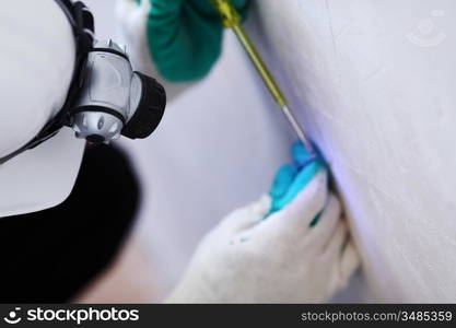 worker puts the wires in the wall