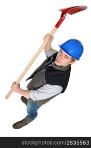 Worker raising spade in the air