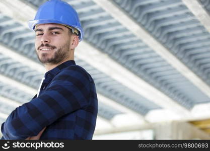 worker standing smiling on white background