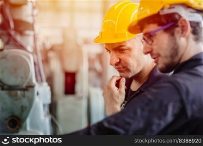 worker thinking, service team working with machine together teamwork in heavy industry factory with safety helmet.