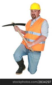 Worker using a pickaxe