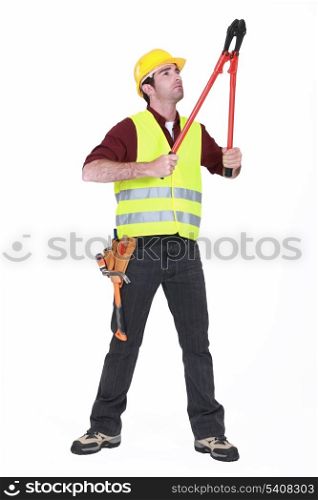 Worker using bolt cutters