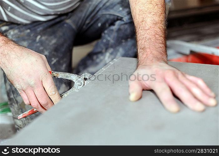 Worker using nibblers