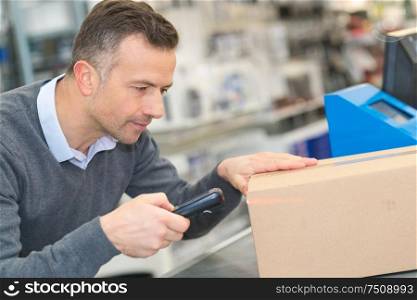 worker using scanner in the warehouse