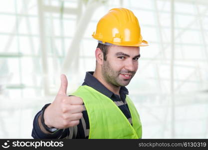 Worker wearing hard hat and going thumb up