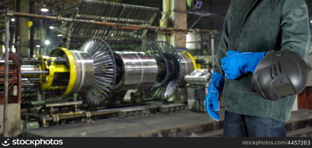 Worker welder at factory. Worker welder with instruments at industrial factory