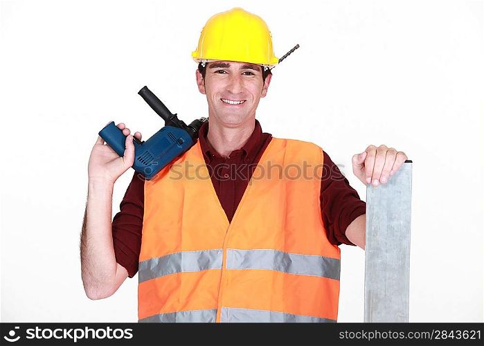 Worker with a large drill