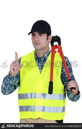 Worker with a pair of bolt cutters