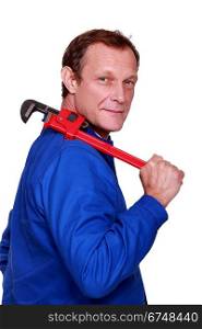 Worker with a pipe wrench