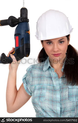 Worker with a power drill
