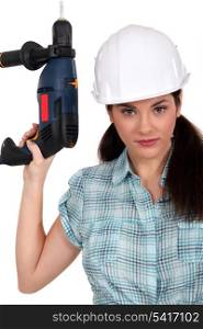Worker with a power drill