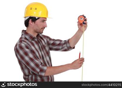 Worker with a tape measure