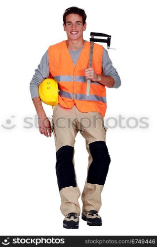 Worker with an F clamp