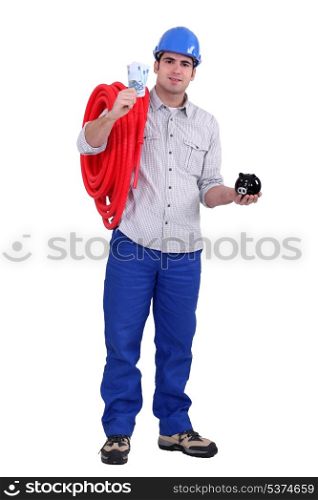 Worker with bank notes and piggy bank