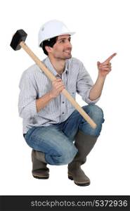 Worker with big hammer