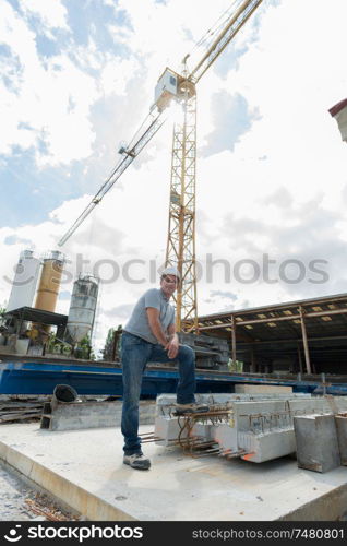 worker with crane on the background