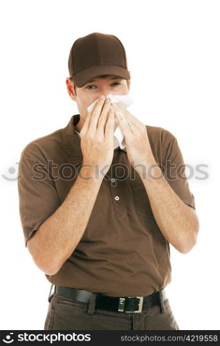 Worker with flu blowing his nose. Isolated on white.