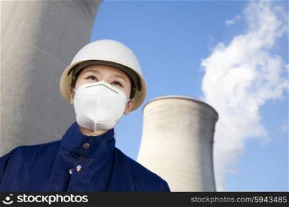 Worker with hardhat and mask at power plant