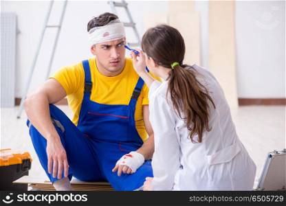 Worker with injured head and doctor