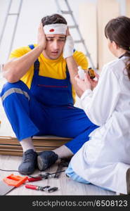 Worker with injured head and doctor