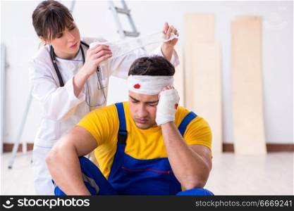 Worker with injured head and doctor