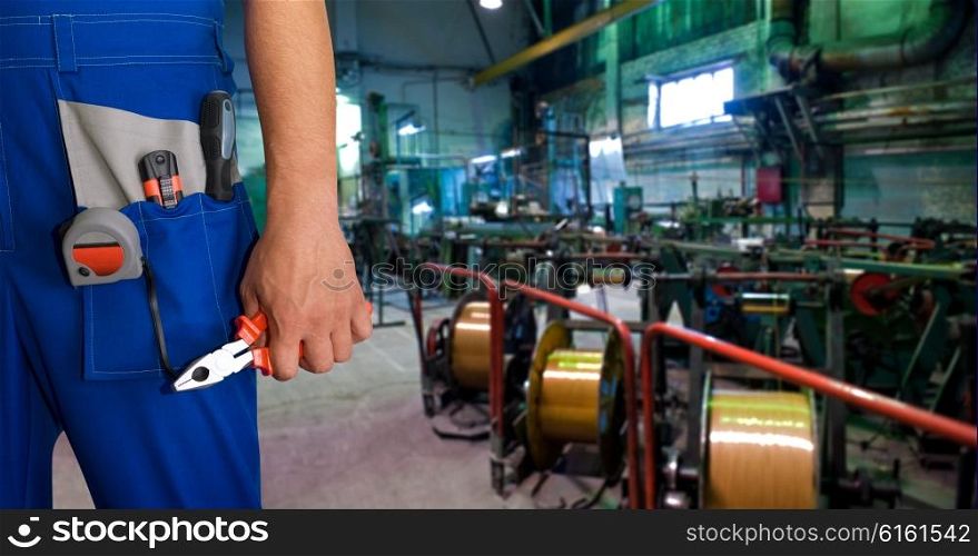 Worker with instruments . Worker with instruments at industrial factory