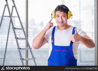 Worker with noise cancelling headphones