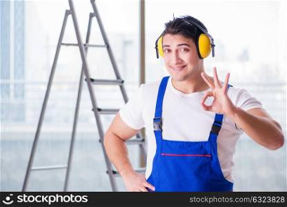 Worker with noise cancelling headphones