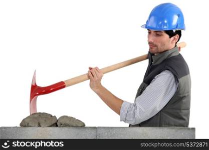 Worker with spade and cement