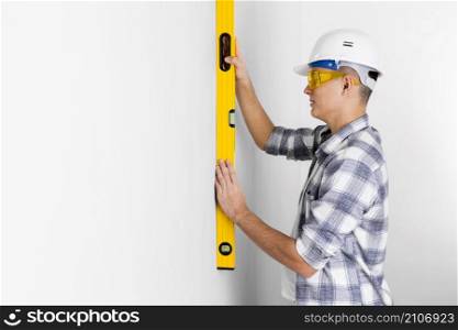 worker with spirit level with copy space