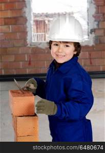 Worker working on a brick construction. Small worker working on a brick construction