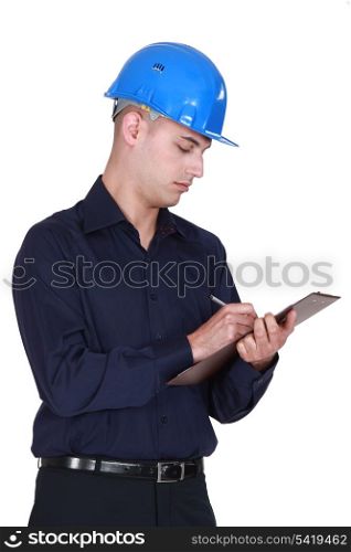 Worker writing on clipboard.