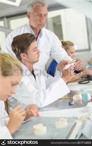 Workers in a dental laboratory